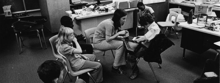 Teacher and children in a classroom 