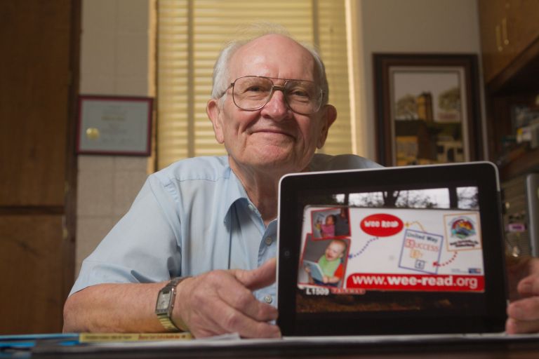 Bill Flatt with tablet promoting www.wee-read.com