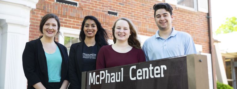 Students in front of McPhaul Center sign