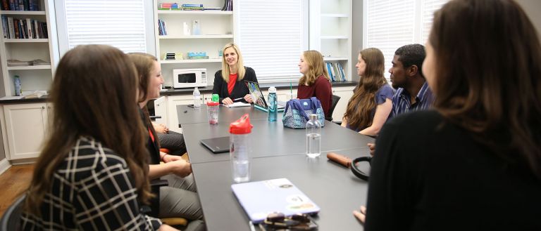 Faculty and students having meeting 