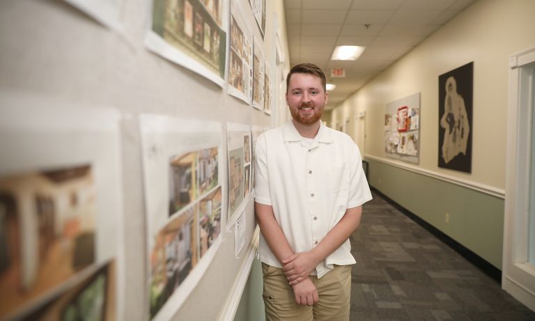Student Barron Wallace standing in Barrow Hall