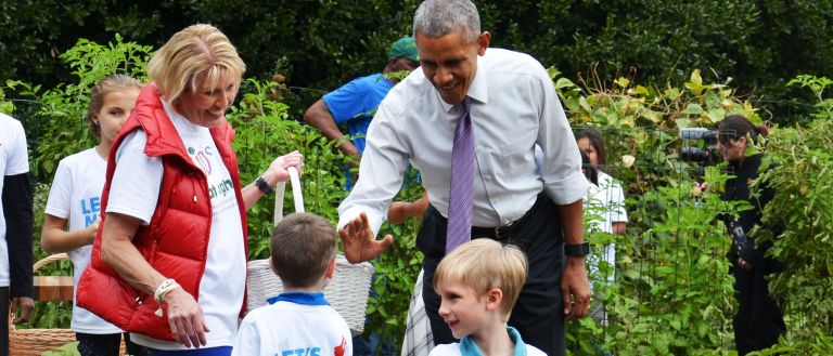 President Obama with children on farm 