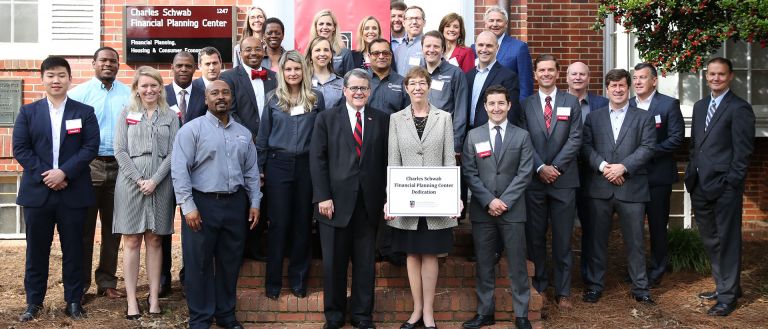 Group photo of people celebrating Schwab opening