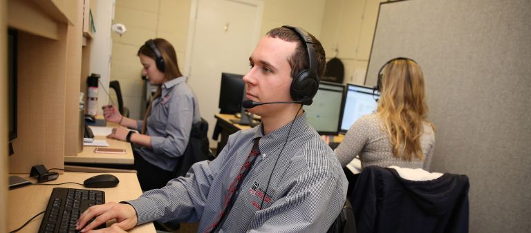 Man with headphone on computer