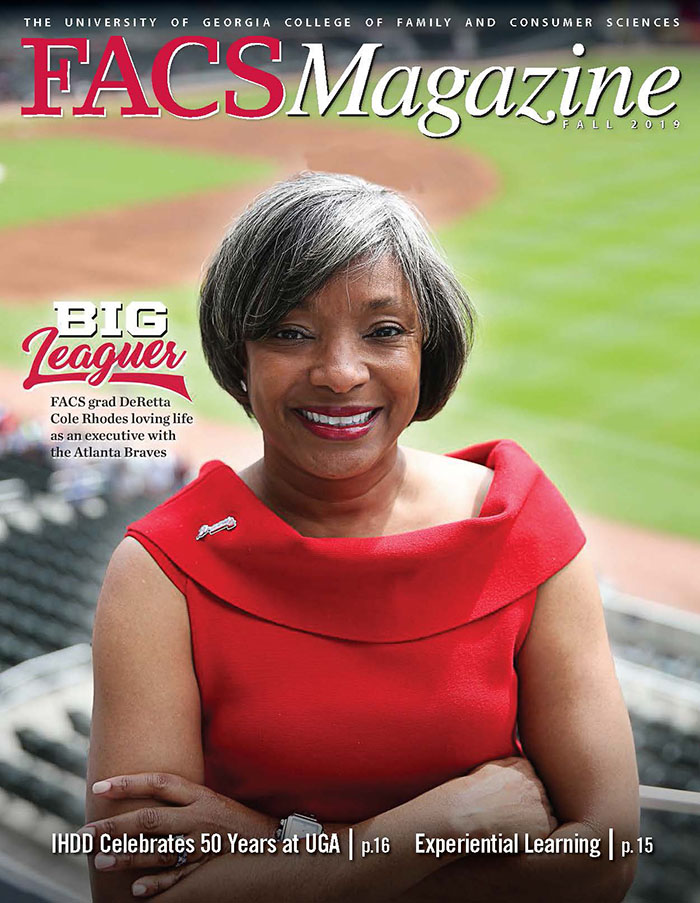 Woman wearing red blouse in baseball stadium